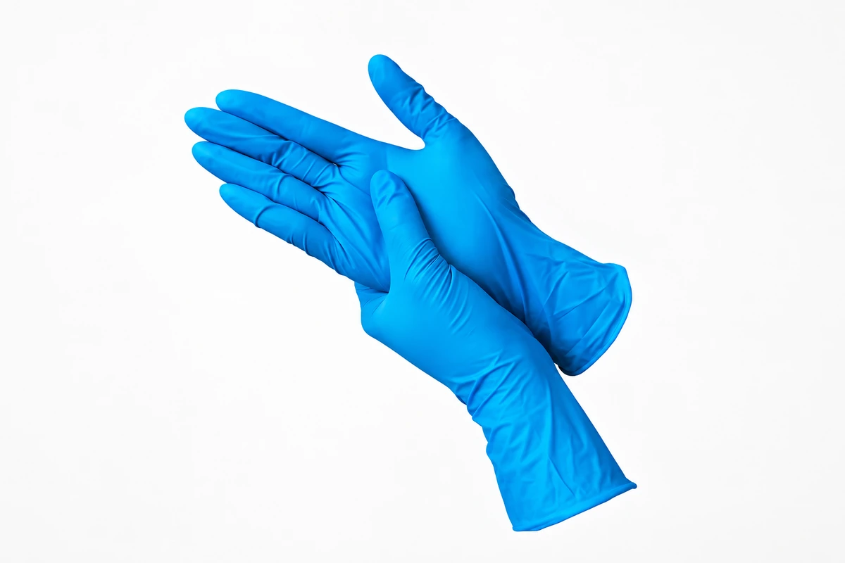 Blue fitted disposable gloves with gathered wrinkles at the wrists