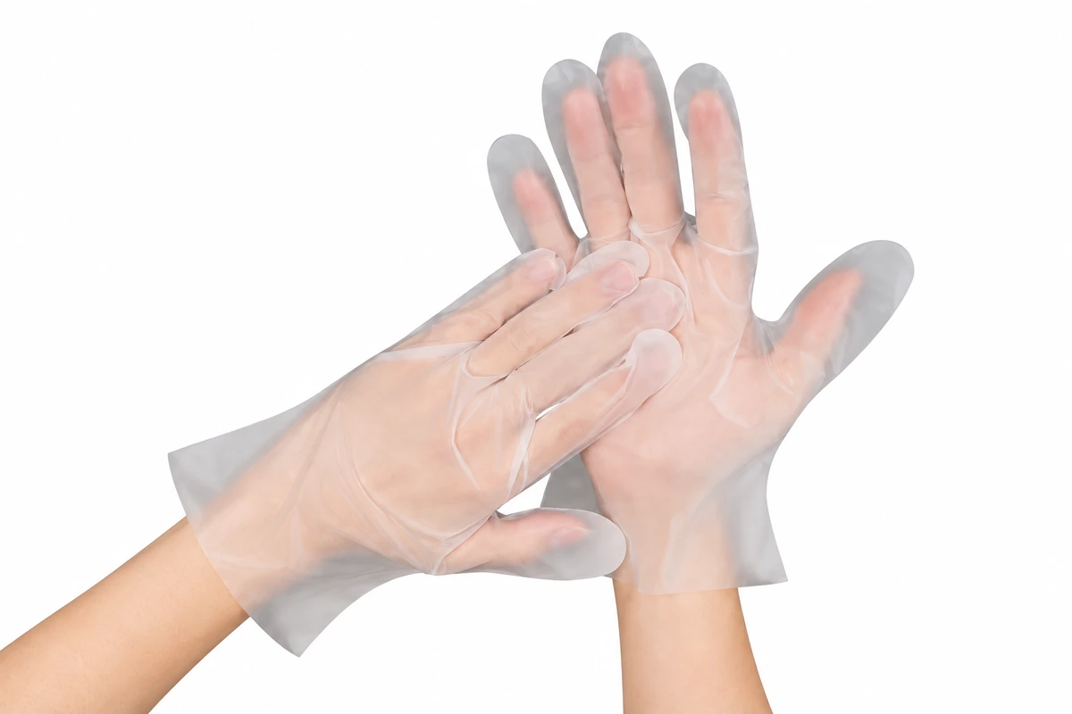Clear loose-fitting gloves with one hand resting across an open palm