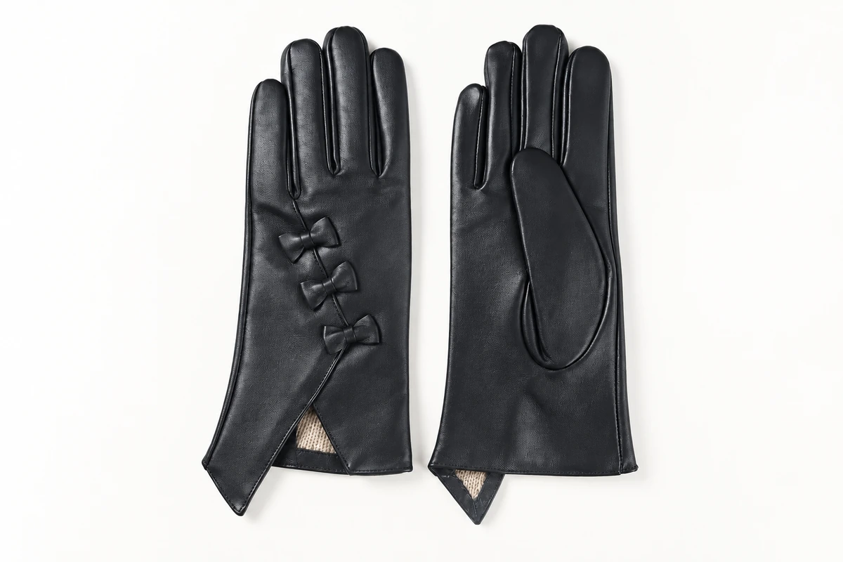 Black gloves showing three wrist bows, pointed cuffs, and the palm