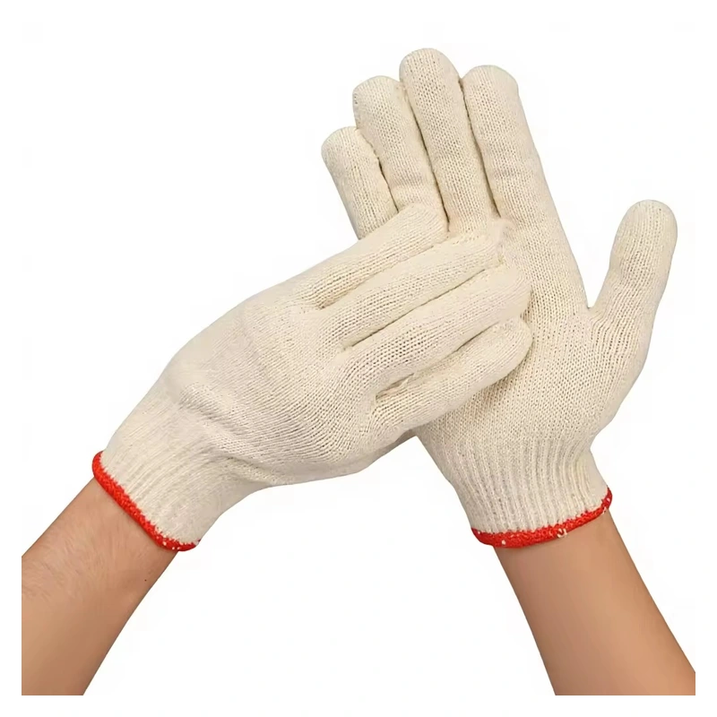 Cream knitted gloves with red-edged cuffs, worn on crossed hands