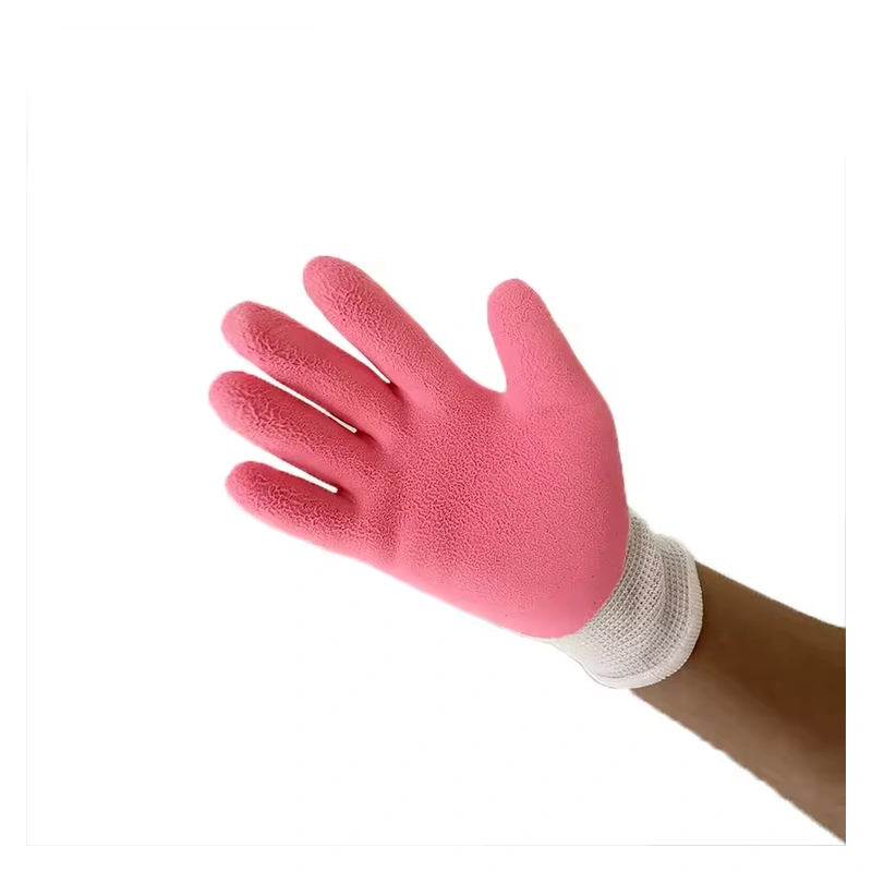 Hand wearing a small garden glove with a pink coated palm and white knit cuff