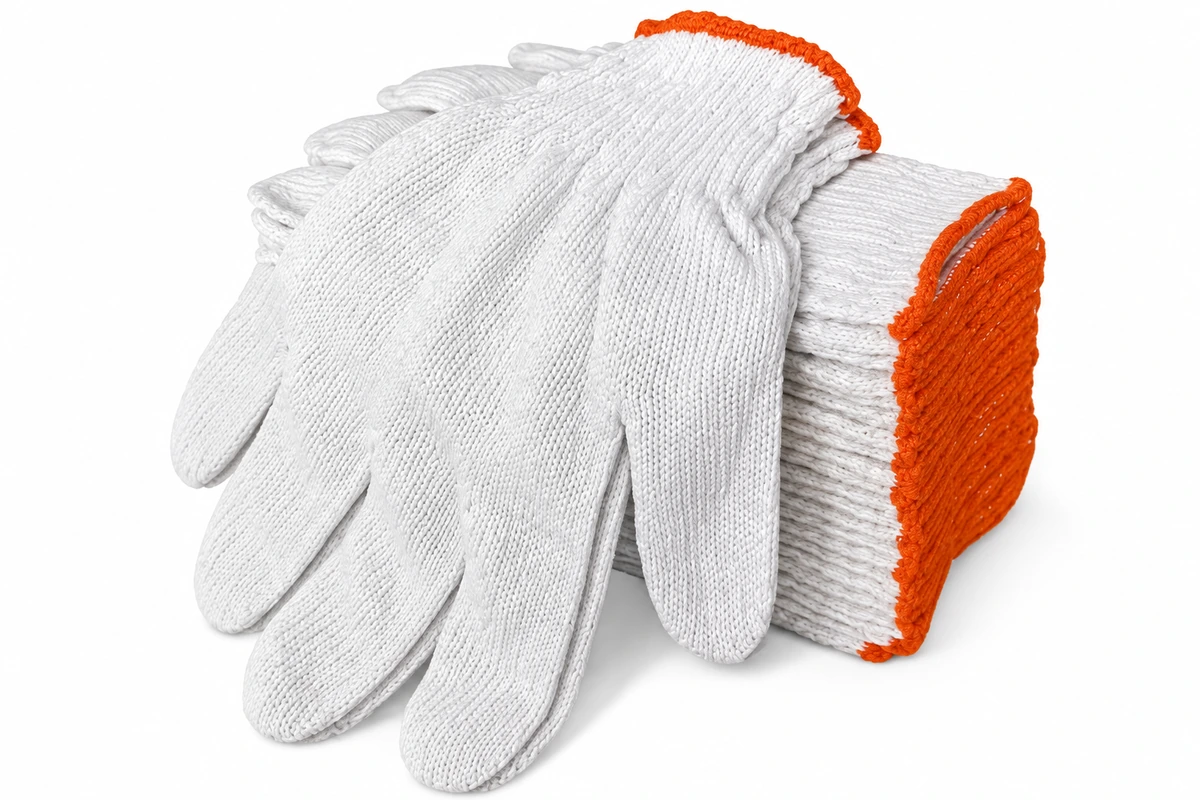 Stacked white knitted gloves with orange-edged cuffs