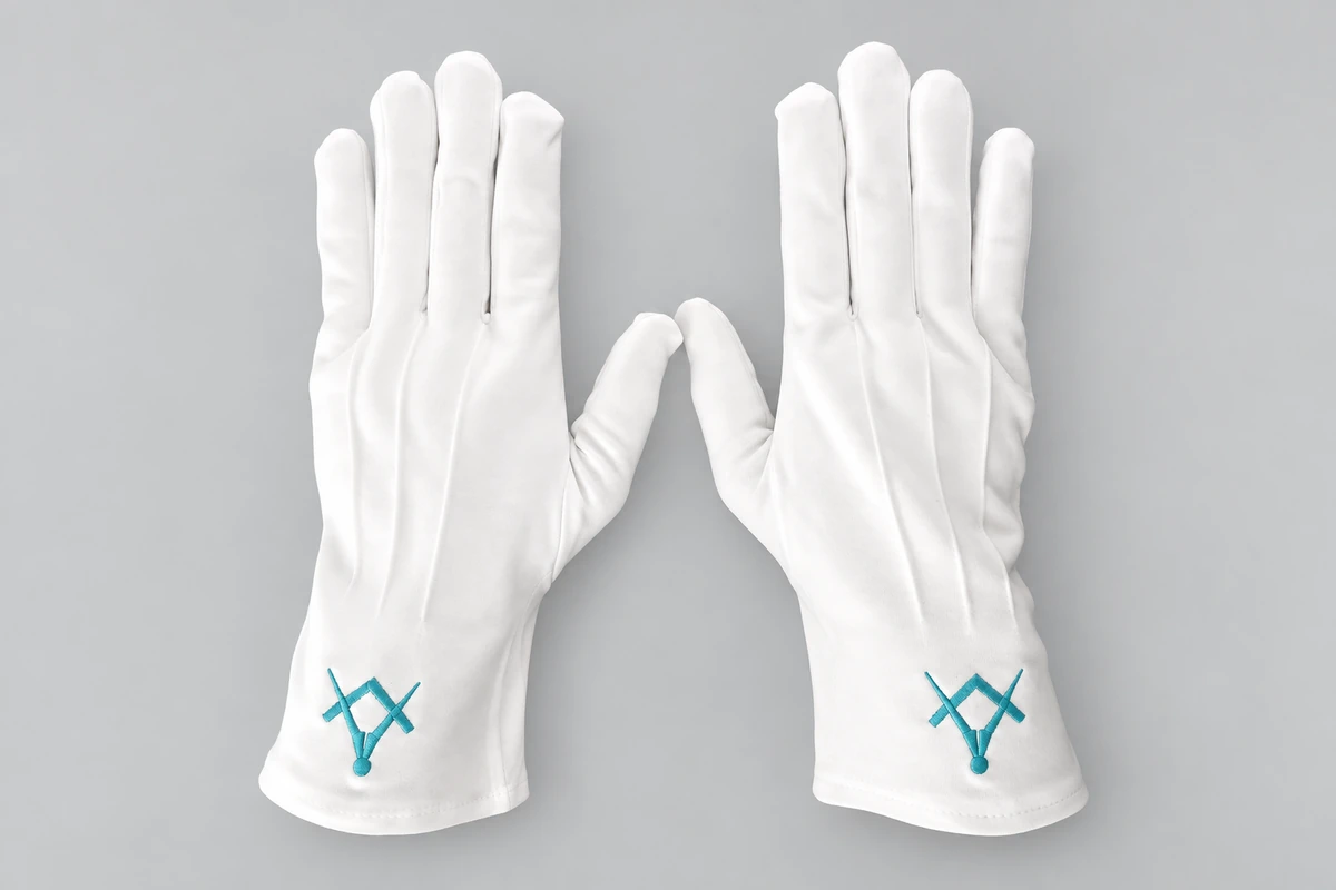 White gloves with turquoise embroidered cuff symbols