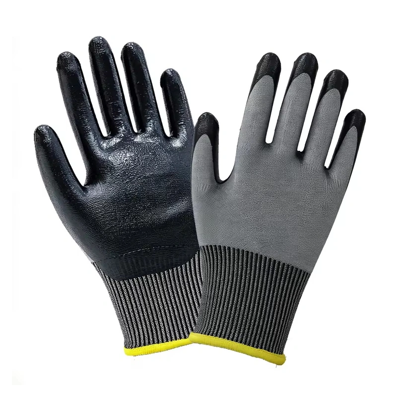 Gray knit work gloves with black coated palms and yellow cuff edges