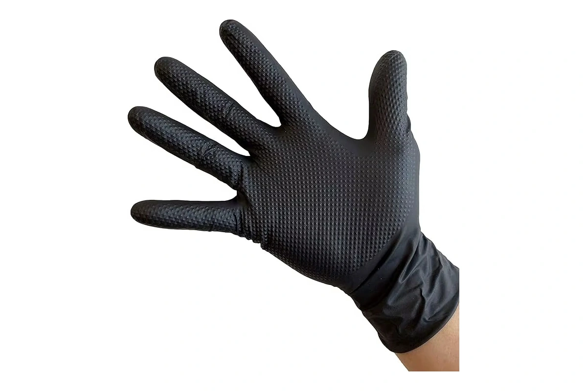 Black disposable glove showing a textured palm and loose wrist folds