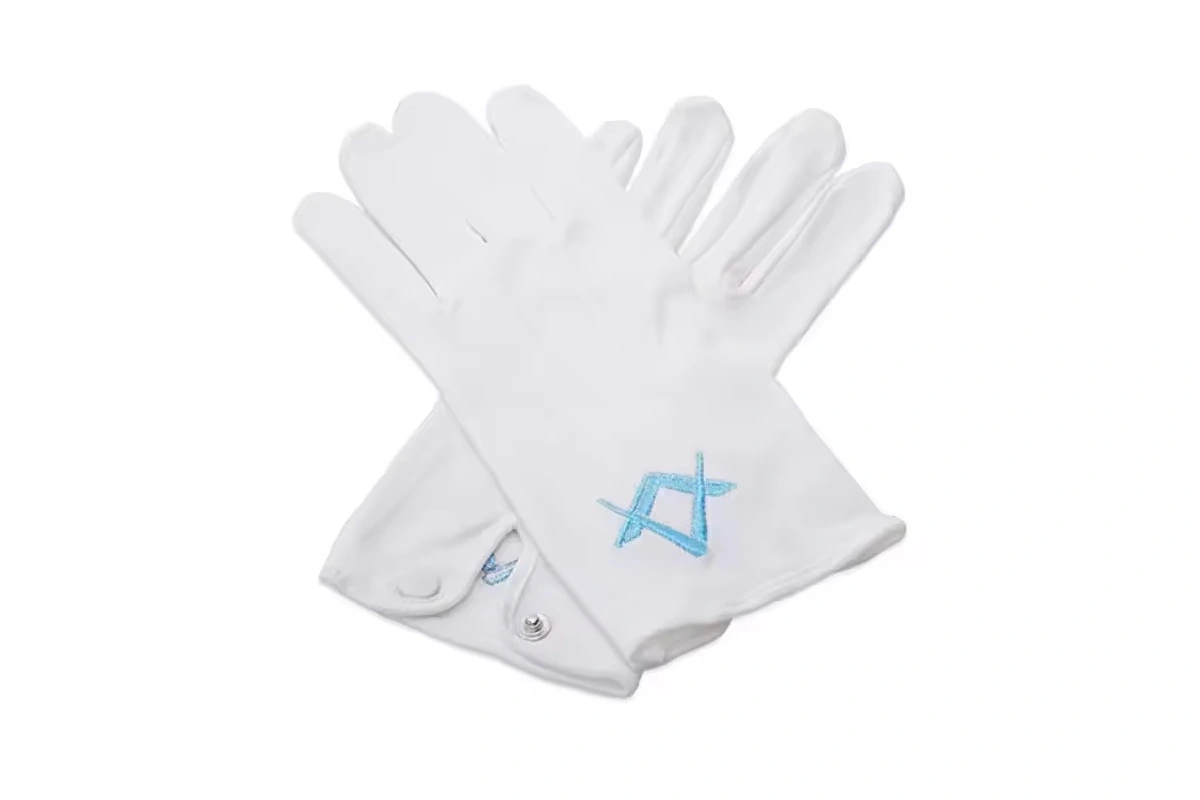 White gloves with turquoise embroidered cuff emblems