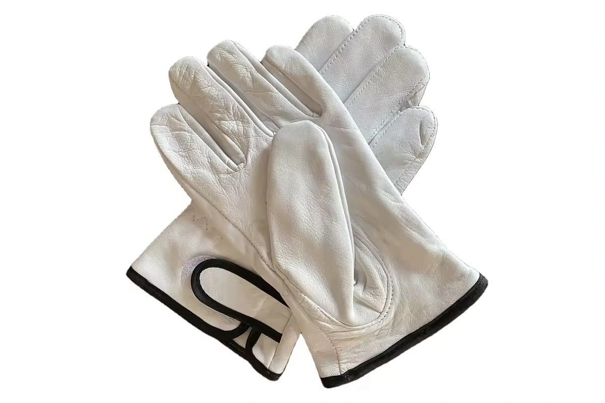 Light leather work gloves with black wrist trim
