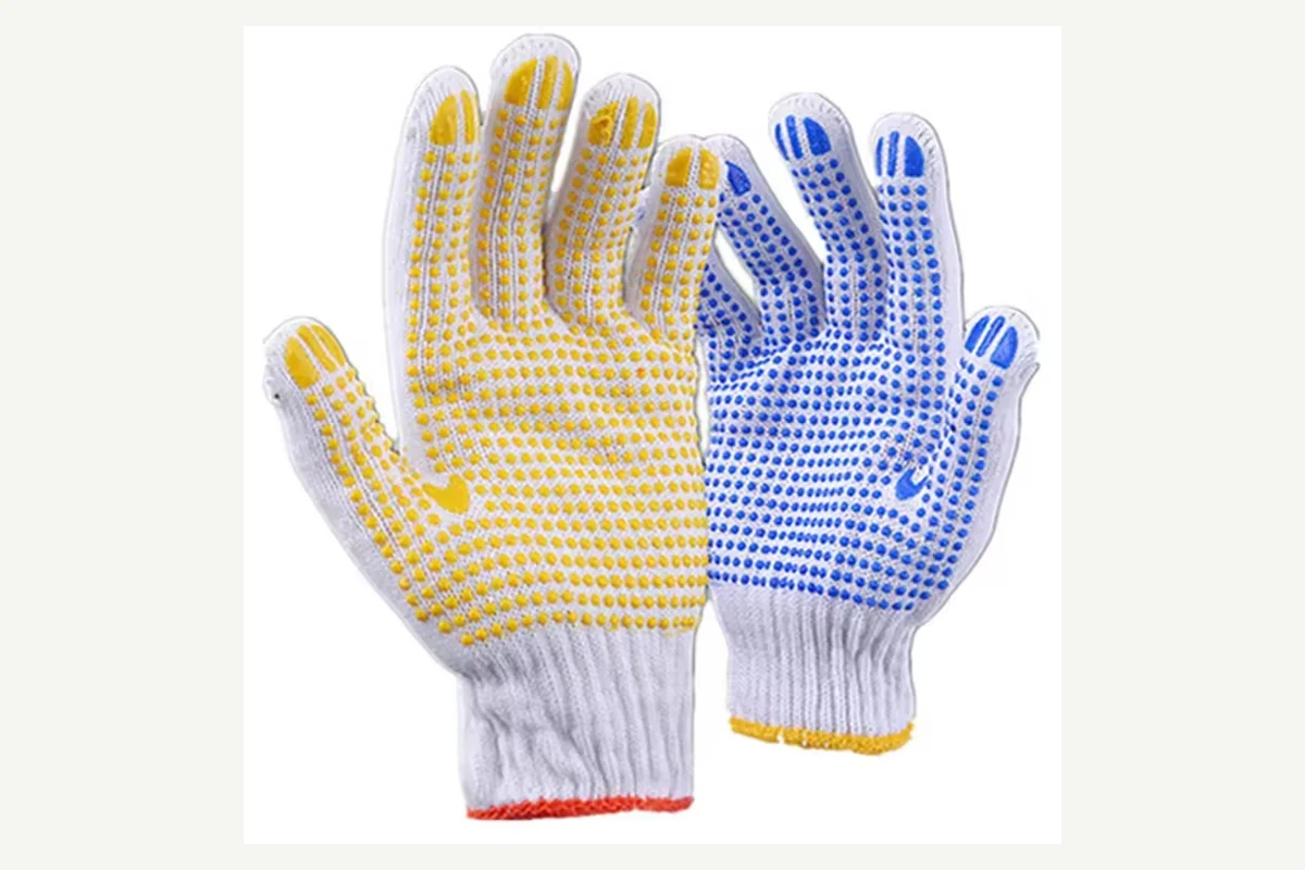 White knit gloves with yellow and blue dotted palms