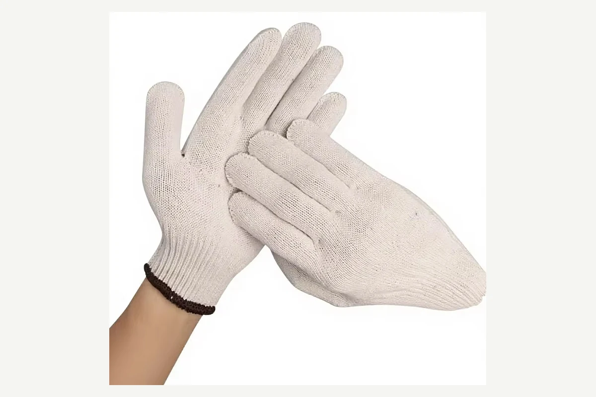 Beige knit gloves showing yarn and cuff colors