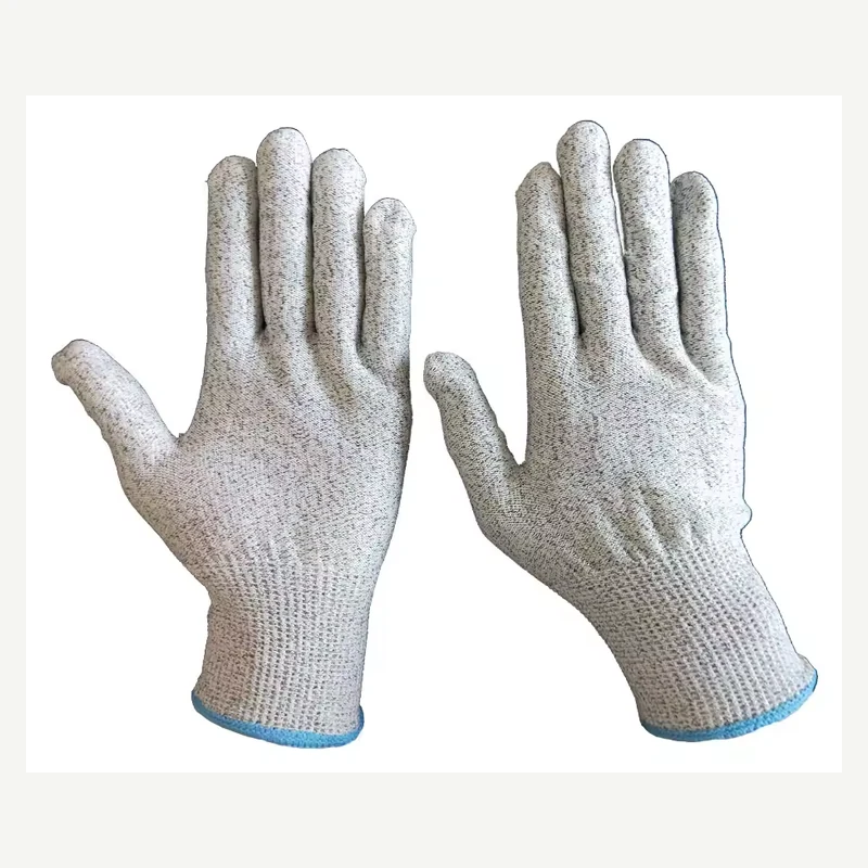 Light gray knitted gloves with blue-edged cuffs worn on both hands