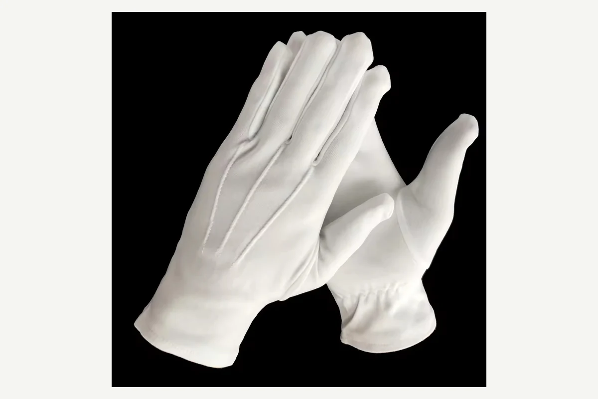 White gloves on crossed hands with open palms