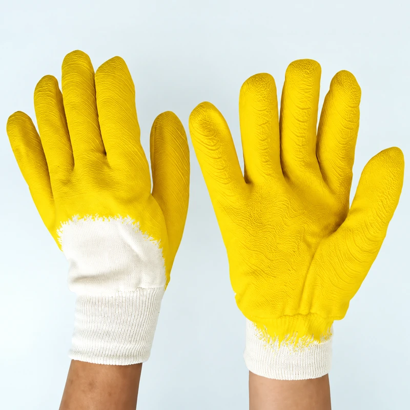 Yellow work gloves worn with palm and back facing forward