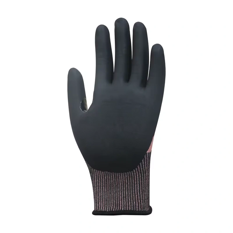 Black coated palm and ribbed cuff of a red-gray knit glove