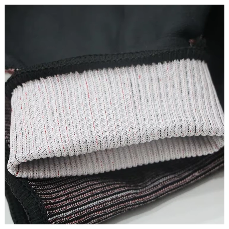 Close-up of the folded knitted cuff interior and stitched edge