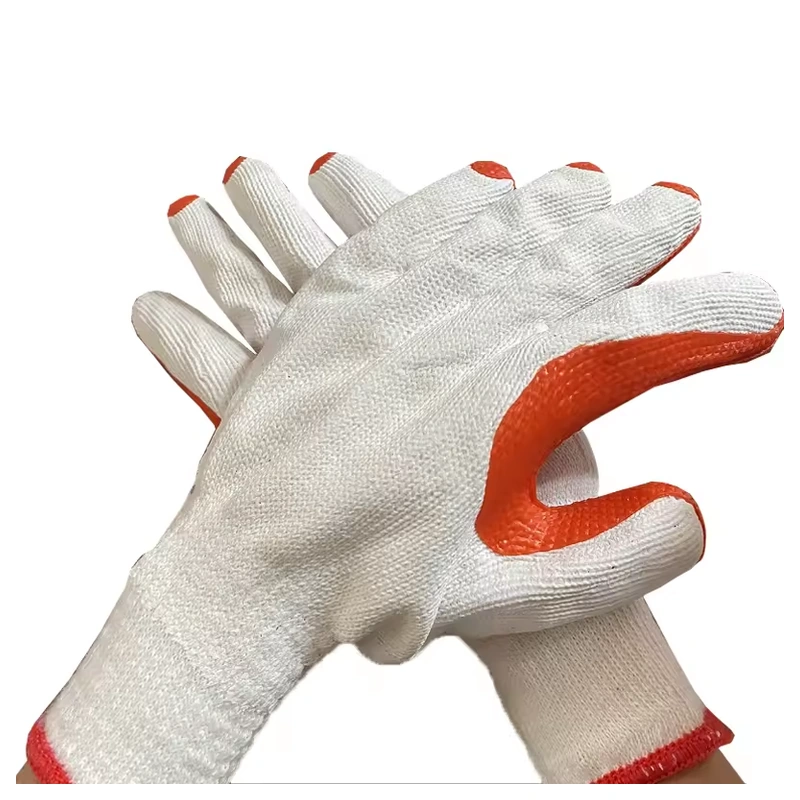 White knitted gloves with orange coated palms worn together
