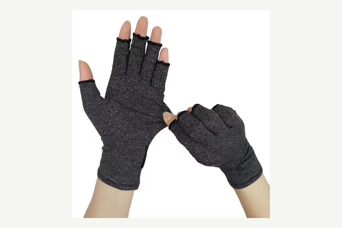Gray knitted fingerless gloves with ribbed cuffs worn on both hands