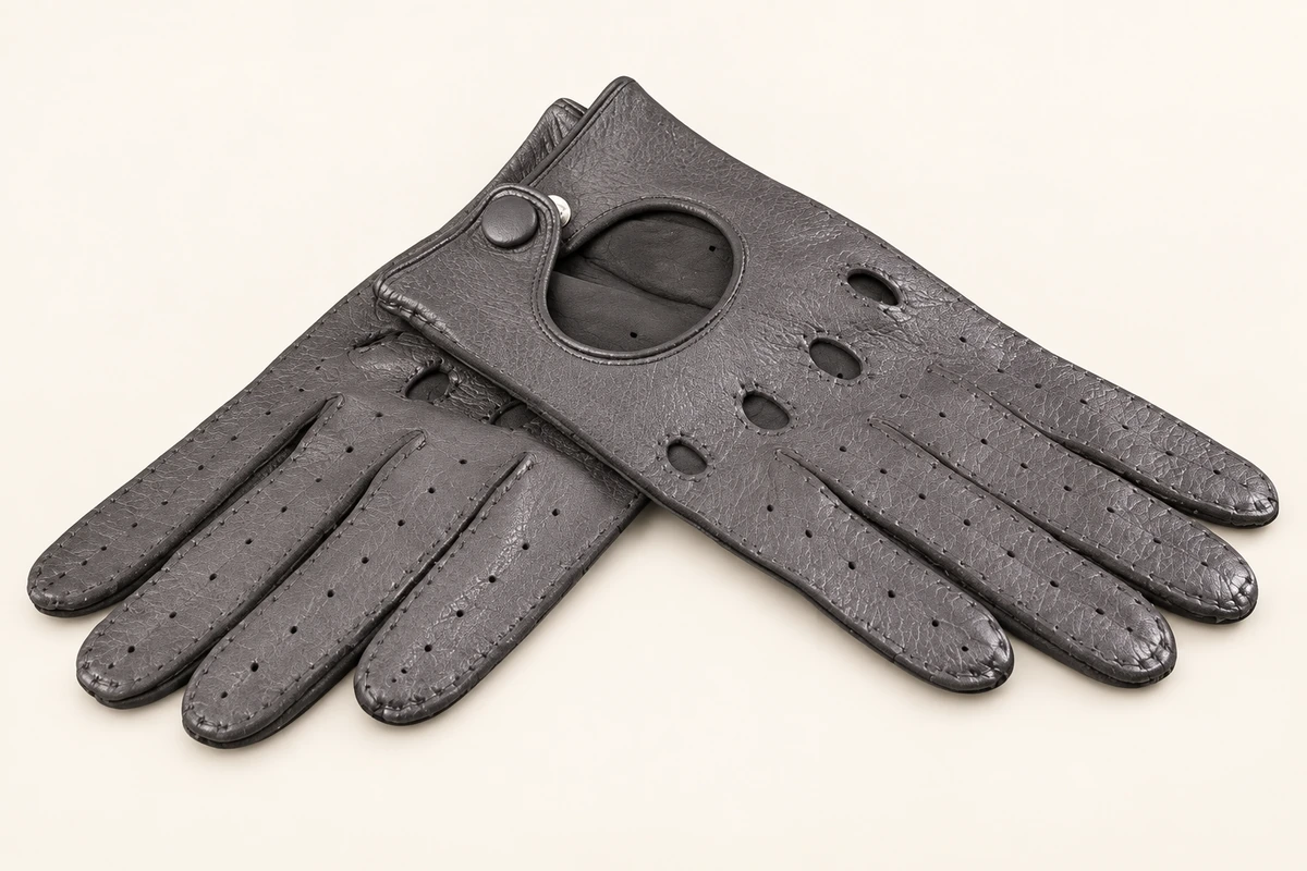 Gray perforated leather driving gloves with button wrist straps