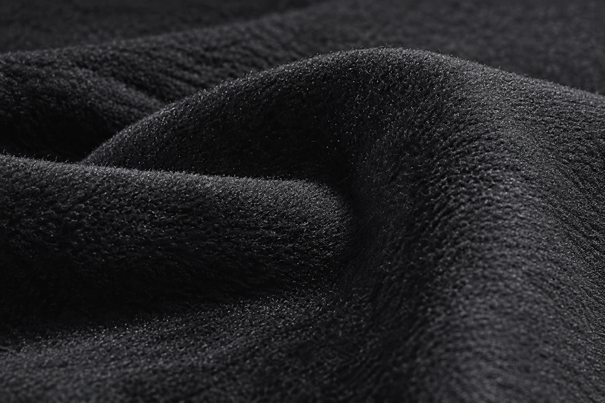 Close-up of black fleece fabric pile