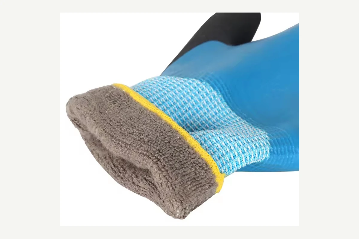Blue coated glove with a folded cuff showing gray fleece lining