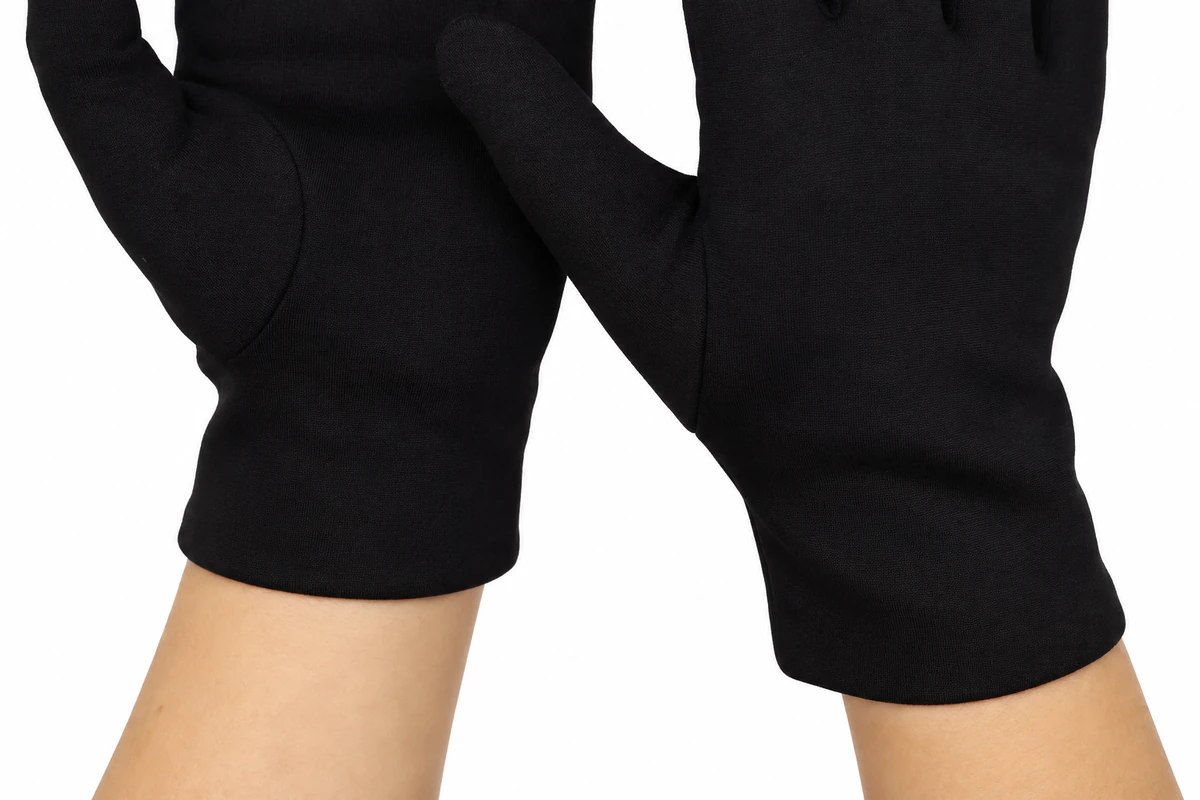 Simple wrist openings on worn black fleece gloves