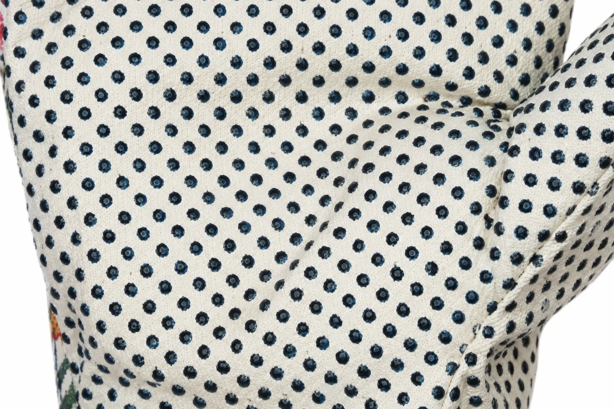 Dark grip dots on a light garden glove palm