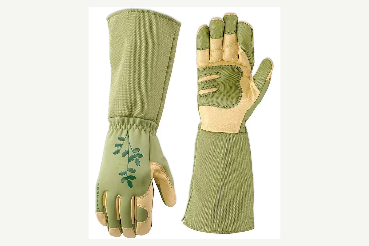 Green gauntlet garden gloves with decorative embroidery