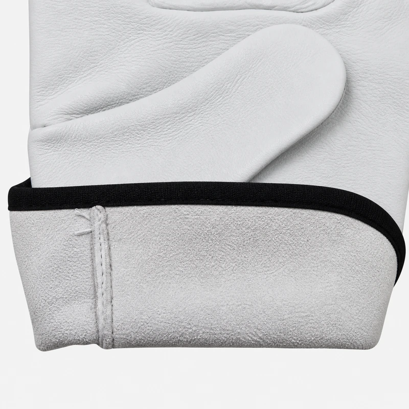 Black binding along the open cuff of a white leather glove
