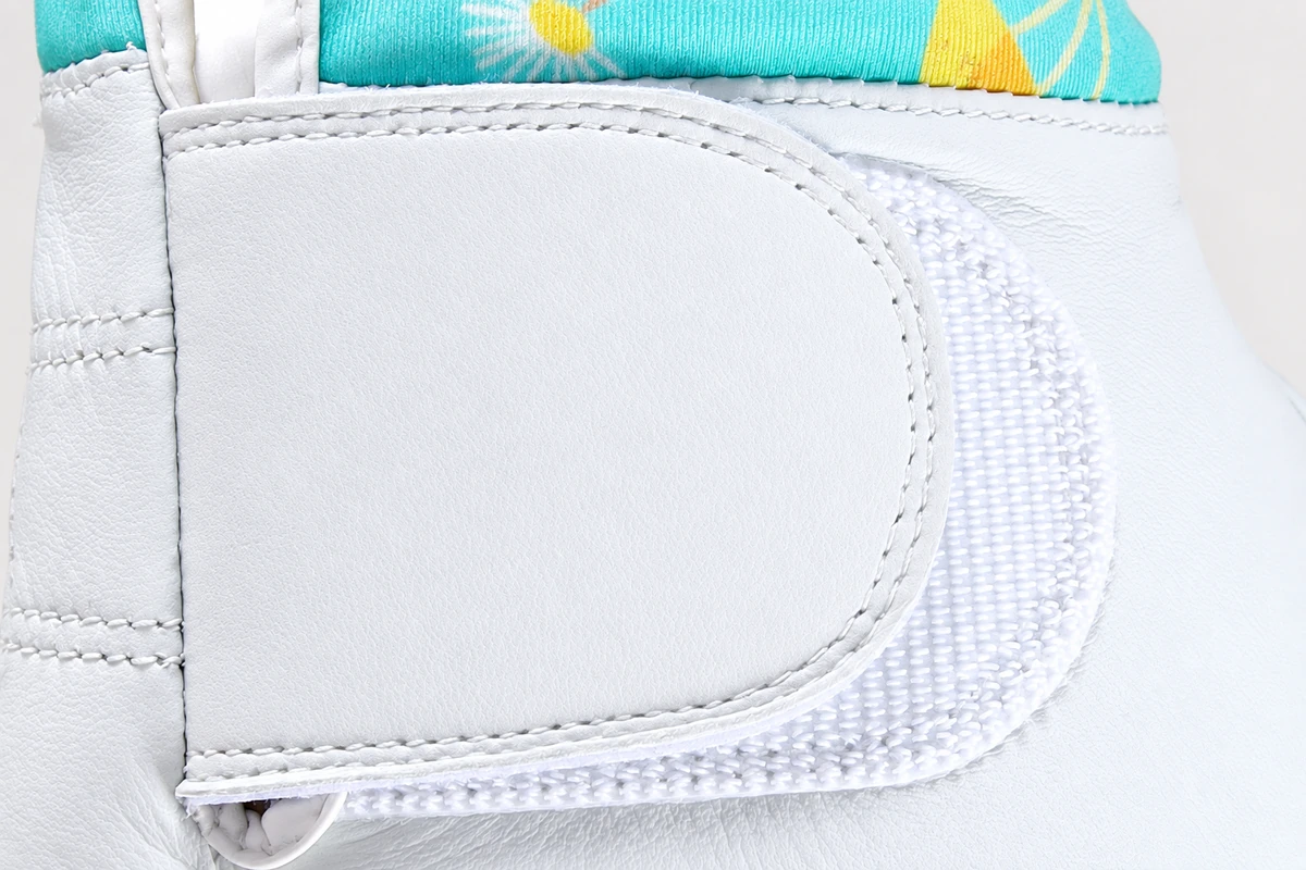 Plain white wrist closure panel with stitched edge