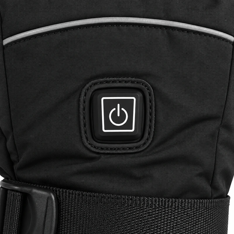 Power button and wrist strap on a black heated glove