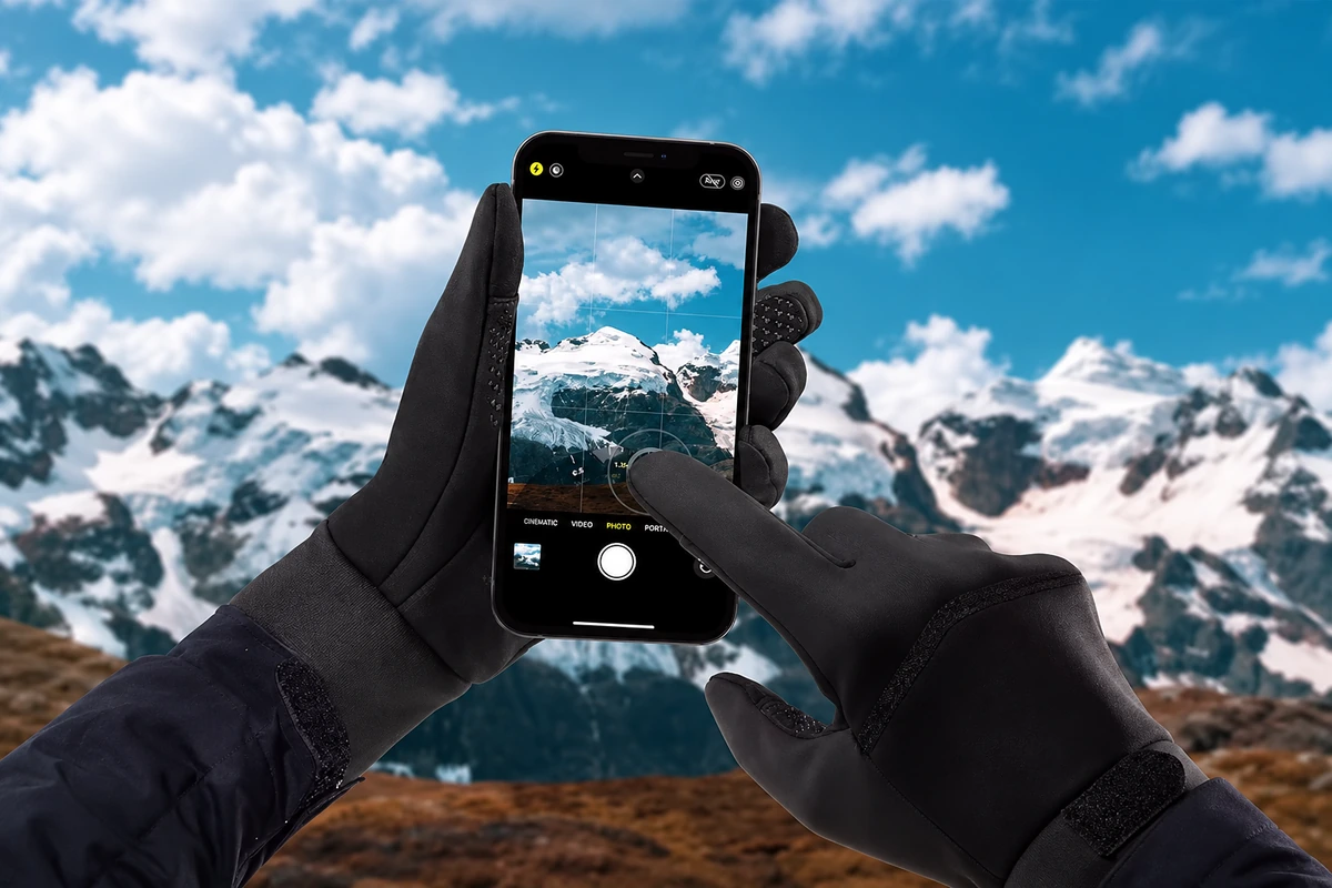 Black gloves operating a phone camera outdoors