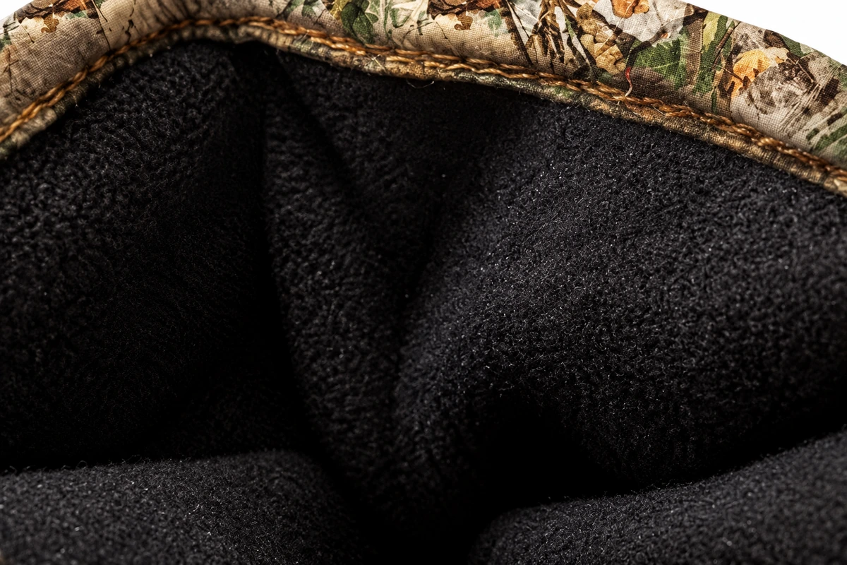 Dark inner lining inside a camouflage glove cuff