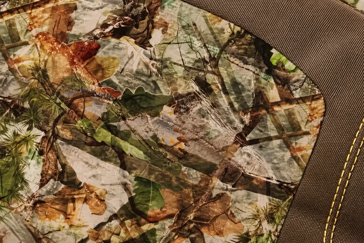 Woodland glove fabric with brown trim and stitching