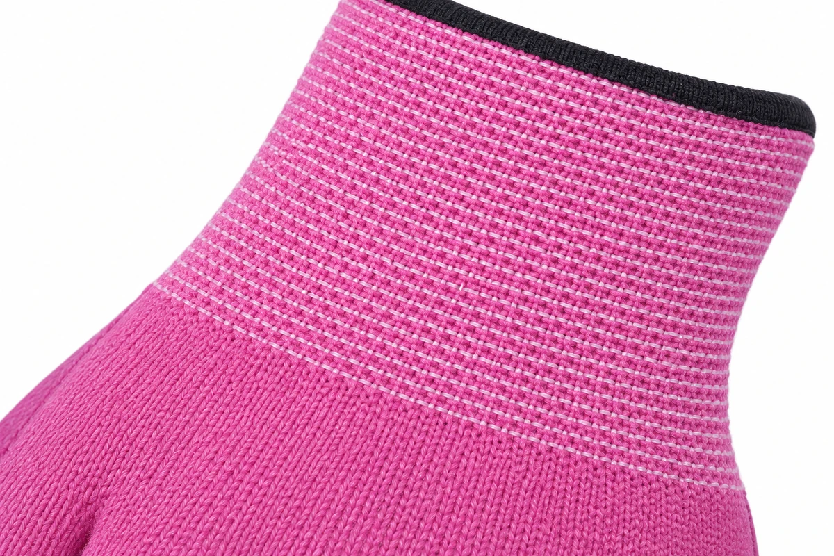 Close view of pink knit fabric on a children’s garden glove