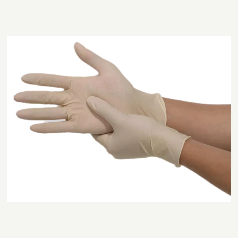 Beige latex glove with an open palm while the cuff is being adjusted