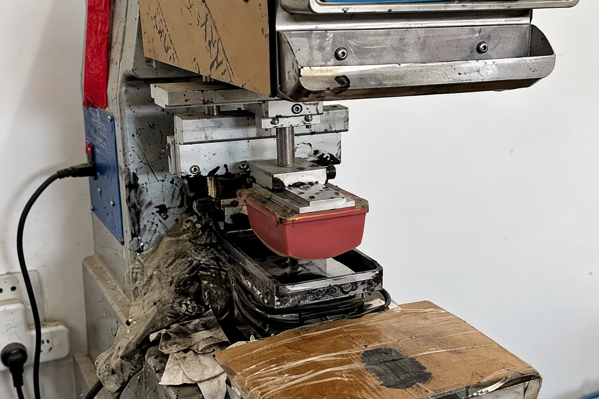 Pad-printing machine with silicone pad and printing fixture