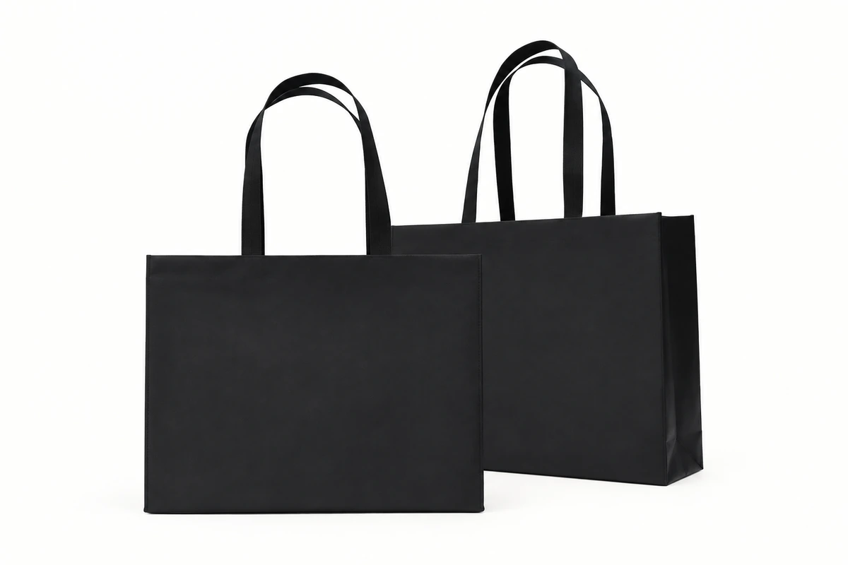 Two plain black presentation bags with handles