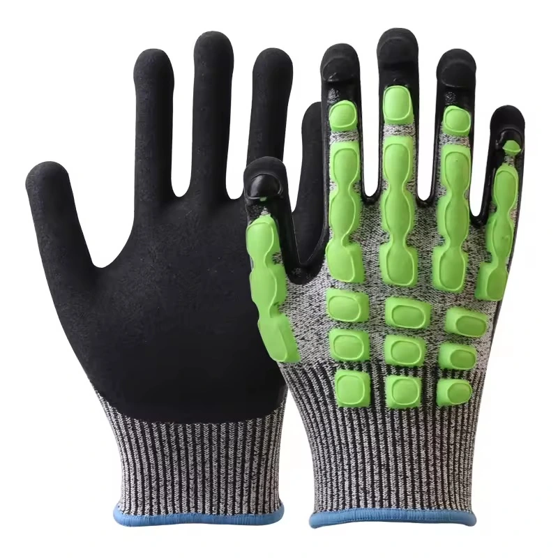 Black mechanic gloves with green impact guards