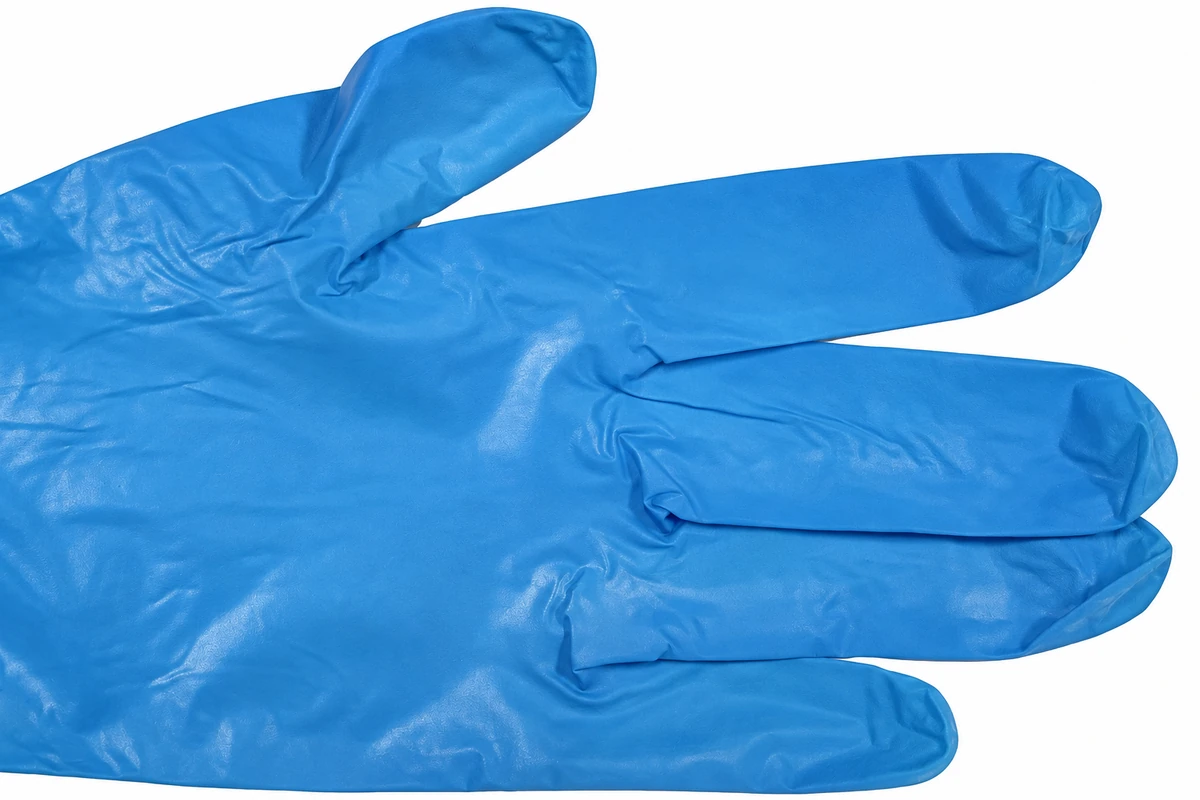 Close view of blue film glove finger edges and folds