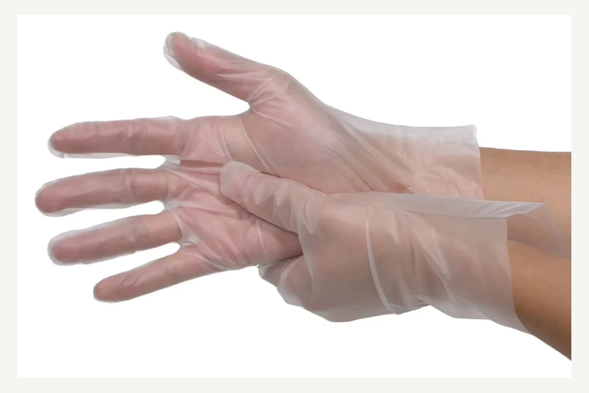 Clear disposable gloves with loose cuffs and spread fingers