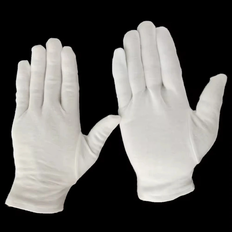 White fabric gloves showing the palm and back of two raised hands