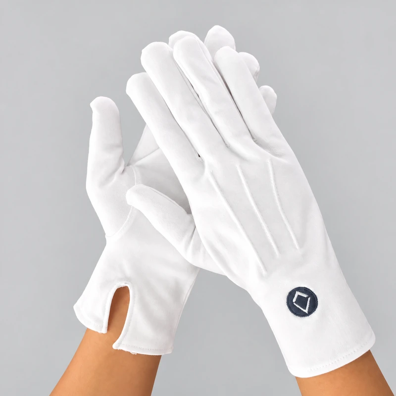 White gloves with a dark circular cuff symbol and wrist openings
