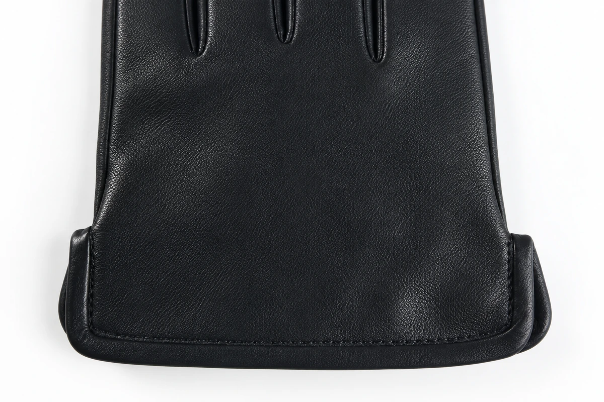 Plain black leather glove back and cuff seam