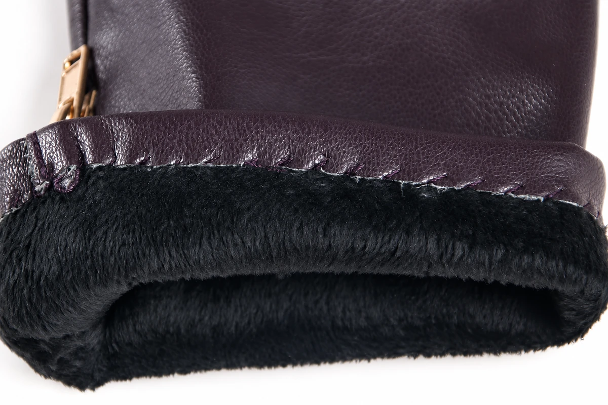 Dark lining joined to a folded leather glove cuff