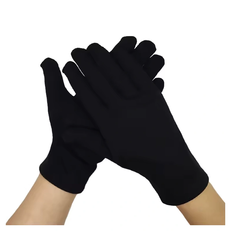 Black fleece gloves worn with the hands crossed
