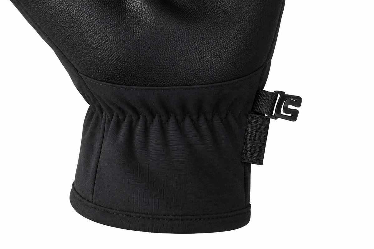 Black glove cuff with gathered stitching and a small side clip