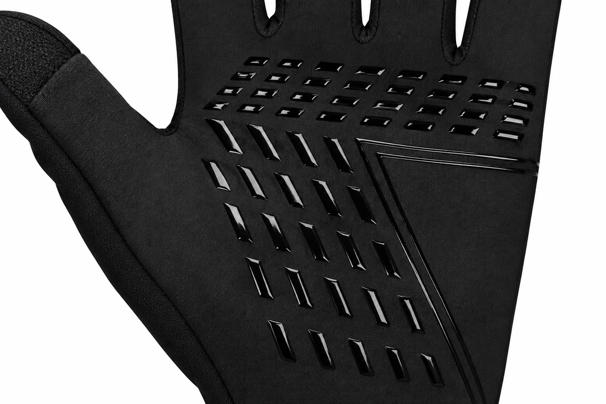 Raised geometric grip pattern on a black glove palm