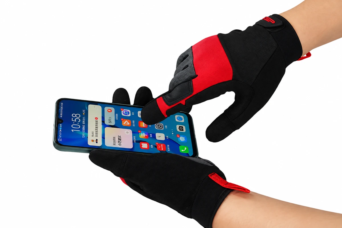 Red and black gloves holding and touching a smartphone