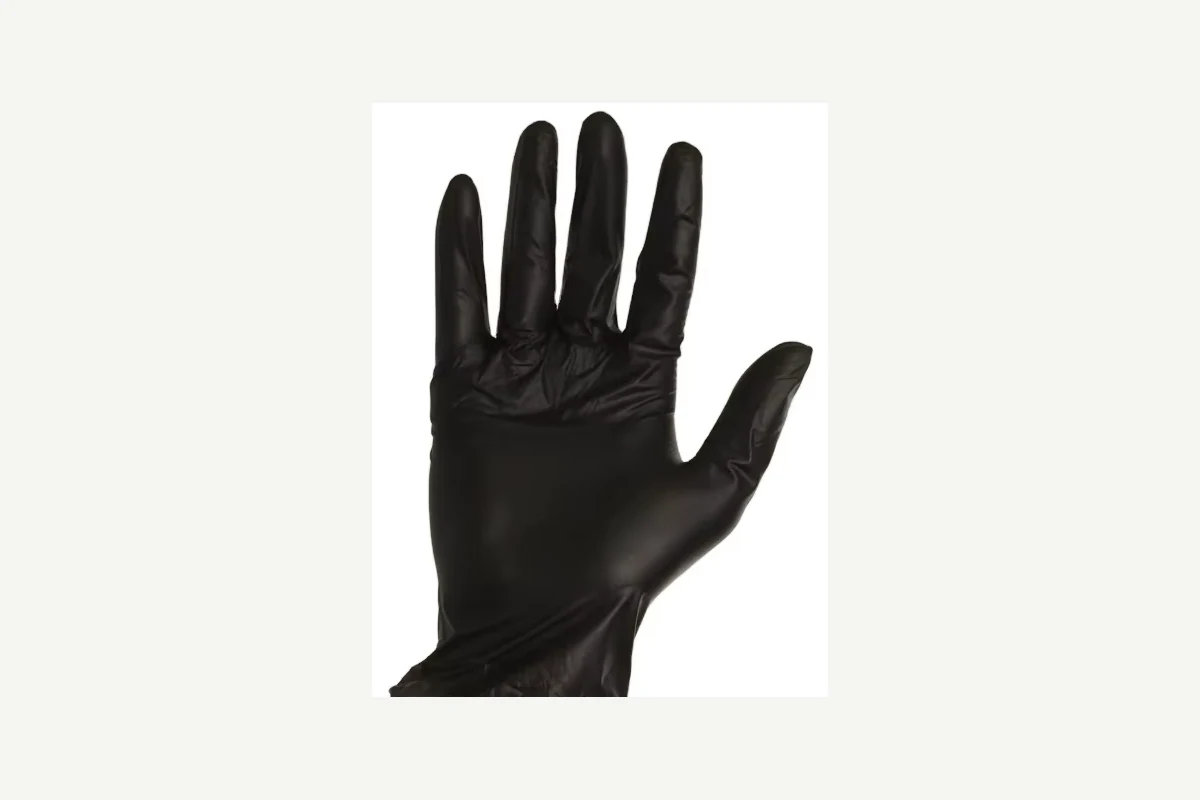 Black disposable glove worn with an open palm and loose cuff