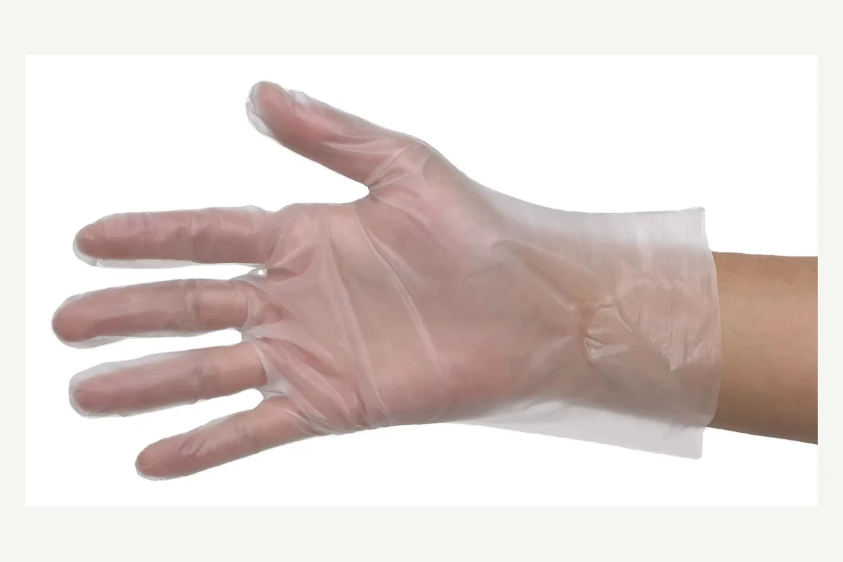 Clear disposable glove with spread fingers and a loose cuff