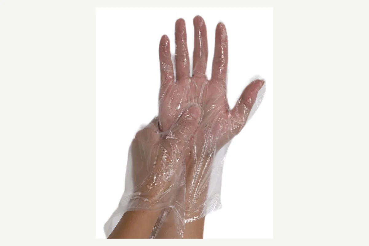 Clear loose-fitting film glove worn with spread fingers